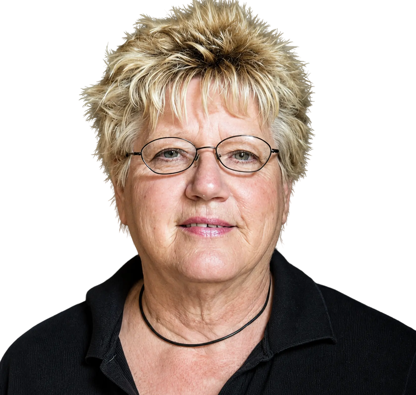 Close-up portrait of a middle-aged woman with short blonde hair and round glasses, wearing a black collared shirt against a black background.